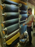 The rolls of denim in stock at Traveller. Erik, one of the owners, is standing right next to them as he explains each one. Source: Austin Scarborough
